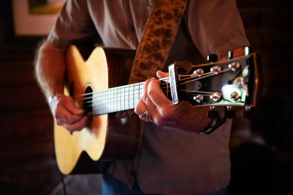 Close-up of acoustic guitar being played